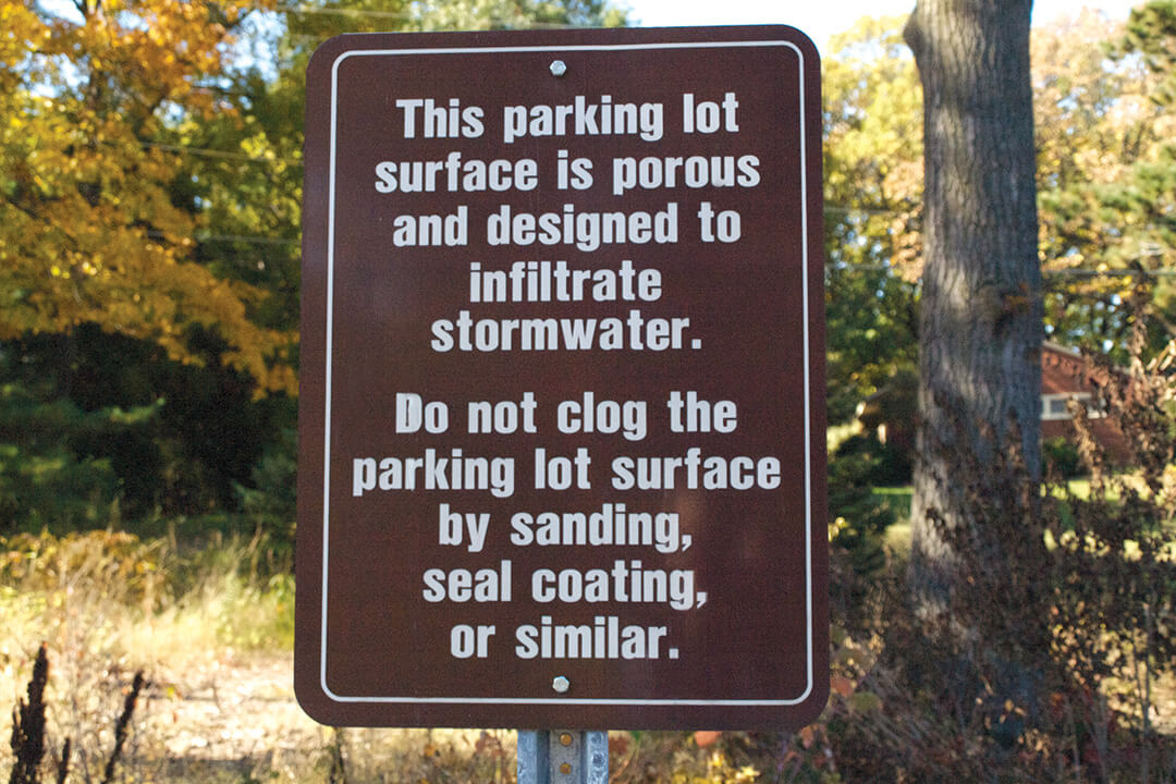 A sign in our parking lot indicating the porous surface.
