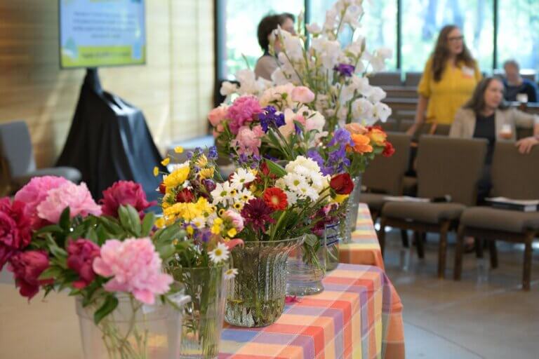 flowers arranged in the front of the sanctuary for flower communion
