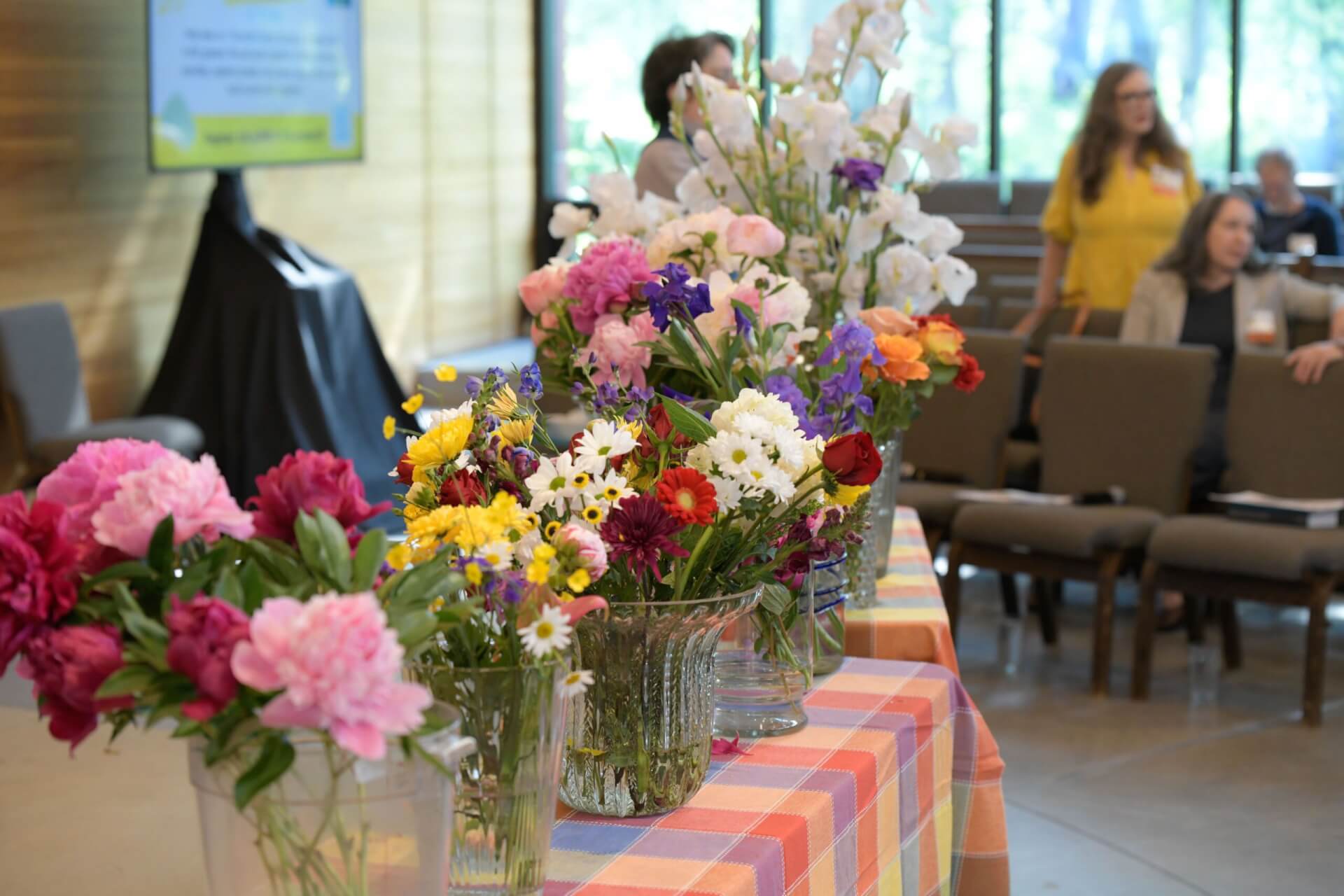 flowers arranged in the front of the sanctuary for flower communion